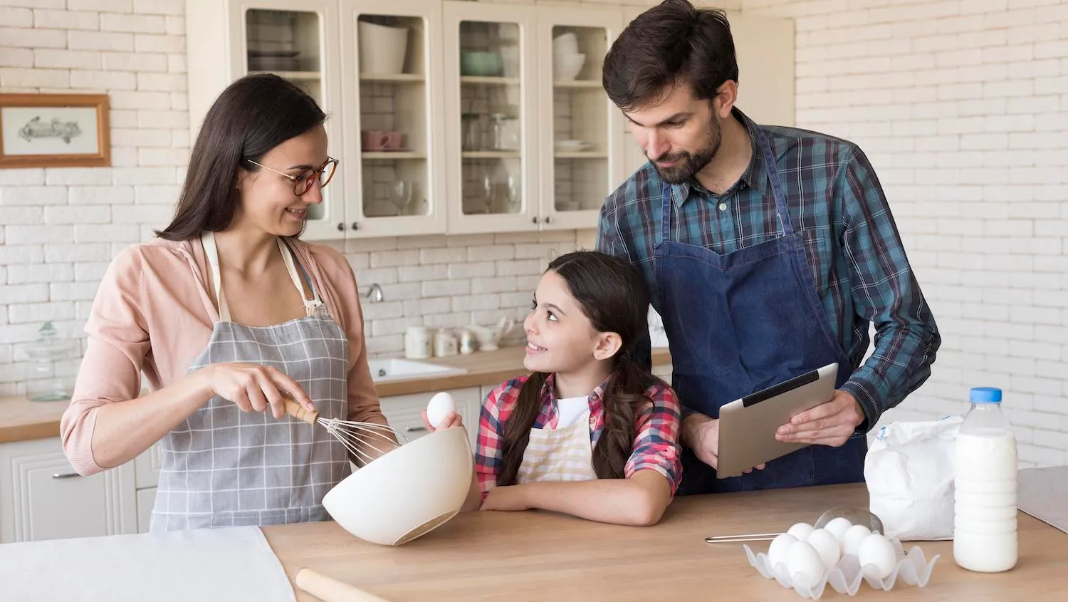 A family cooking together in their kitchen